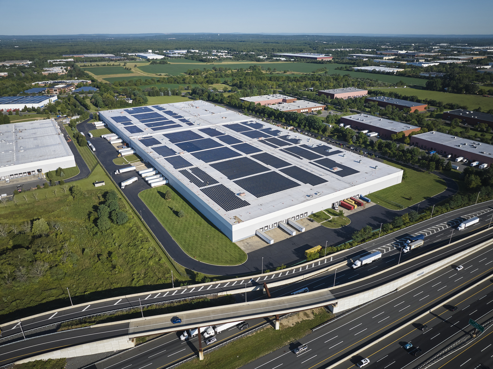 Aerial shot of a Link Logistics warehouse in Cranbury, N.J., that has solar panels installed on its roof.
