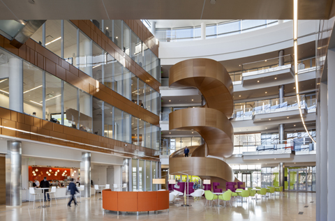 Designed by Robert A.M. Stern Associates, GlaxoSmithKline's headquarters at the Philadelphia Navy Yard employs light and open spaces to create an inviting, collaborative environment. Photo by Francis Dzikowski
