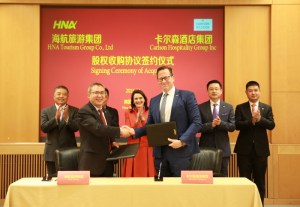BAI Haibo, Chairman & CEO of HNA Hospitality & David P. Berg, CEO of Carlson Hospitality