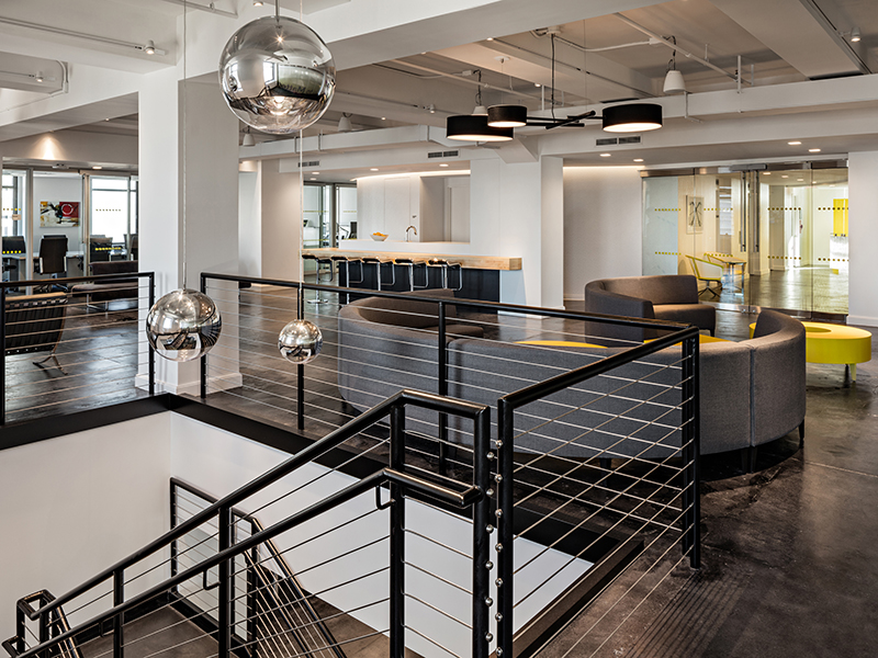 Spector Group’s design for Magna, a New York City investment firm headquartered at 40 Wall St. in Manhattan, illustrates the Millennial influence on the corporate settings of tenants in traditional business categories. Copyright (c) 2015 Ben Gancsos.