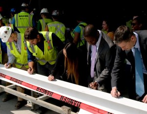 The DC team signs final beam at topping out of 99M St. in Washington, D.C.