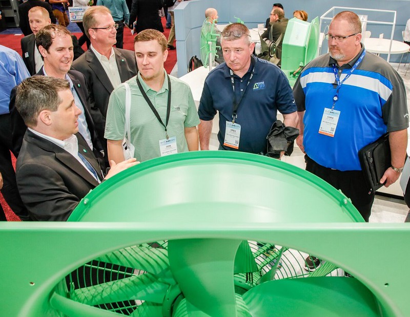 Visitors to the 2017 AHR Expo learn about an exhibitor's product. This year's event is drawing tens of thousands of HVAC professionals to McCormick Place in Chicago.