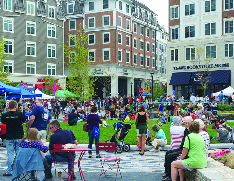College campuses can provide fertile ground for New Urbanism-inspired development. Storrs Center, a $220 million project completed in 2016, forms an integrated, walkable downtown adjacent to the University of Connecticut campus in Mansfield.