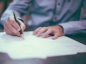 Person signing contract