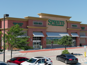 The exterior of a grocery-anchored retail center in Dallas