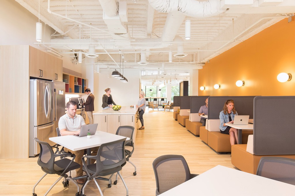 Workbar has several locations in the Boston area, including in Woburn, Mass. (right). Collaborative spaces are key to the design of the company’s coworking properties. Image courtesy of Workbar