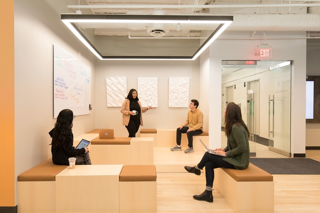 Workbar has several locations in the Boston area, including in Woburn, Mass. (right). Collaborative spaces are key to the design of the company’s coworking properties. Image courtesy of Workbar