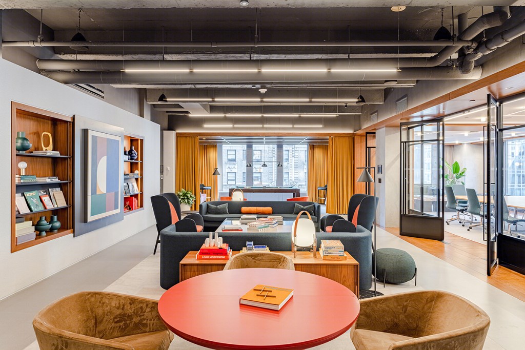 The lounge at 1700 Broadway. Modern spaces that promote socialization and collaboration are key to bringing tenants back into the office. Spaces such as the above have been a prime subject in many marketing campaigns encouraging new leases and returns to in-person work. Image courtesy of Rockpoint