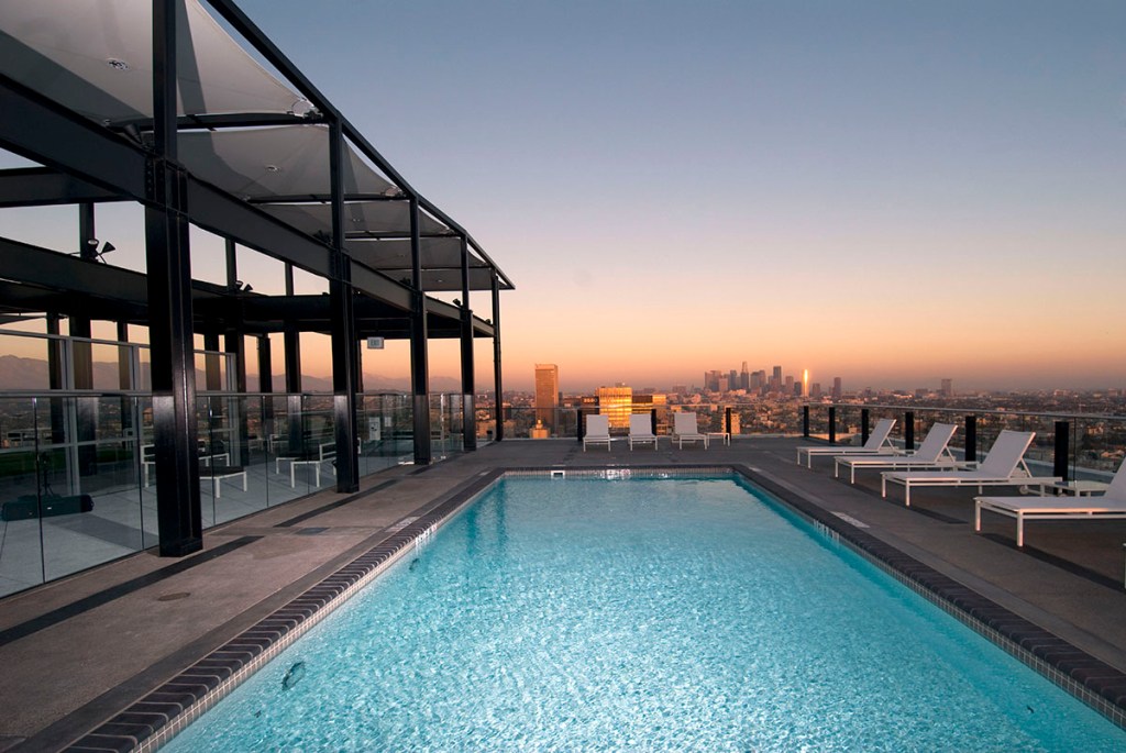 The former Getty Oil Co. headquarters in L.A.’s Koreatown was transformed into 238 condominiums. Amenities include a rooftop pool, gym and lawn. Image courtesy of TCA Architects