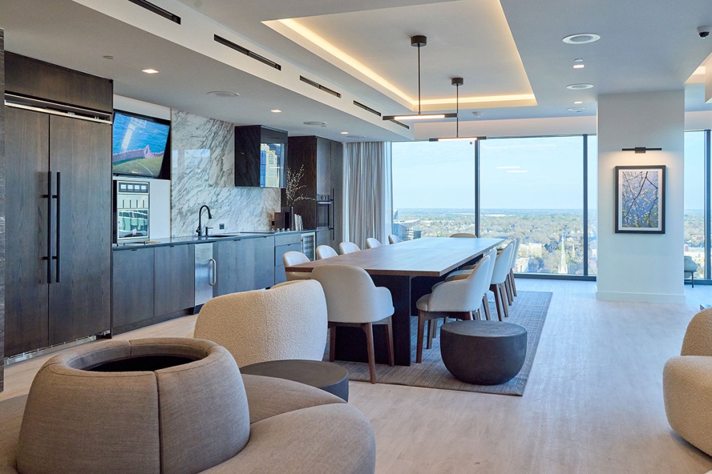 Collaborative meeting spaces are becoming increasingly popular in office design as opposed to isolated workstations. Image courtesy of Trammell Crow Co.
