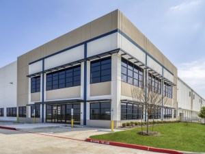 An industrial facility with white, blue and beige facade.