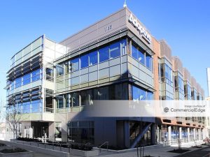 Exterior shot of 1165 Eastlake Ave. E in Seattle, a life science building with glass and different shades of brown facade.