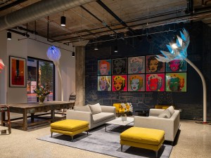 Original flared capital columns and terrazzo flooring have been retained in the lobby of 6 Corners Lofts. MG2’s adaptive reuse of a 1938 Sears store and warehouse in Chicago demonstrates multiple flexible design features. Image by John Boehm