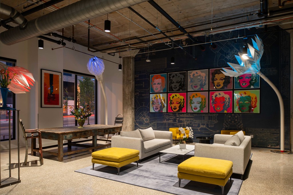 Original flared capital columns and terrazzo flooring have been retained in the lobby of 6 Corners Lofts. MG2’s adaptive reuse of a 1938 Sears store and warehouse in Chicago demonstrates multiple flexible design features. Image by John Boehm