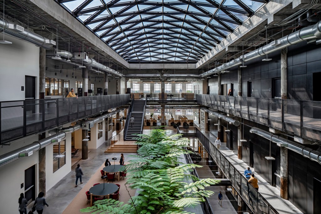 An abandoned Detroit post office was redeveloped into a book depository for the city’s public schools, illustrating  how redesigning old buildings can breathe new life into urban cores struggling with identity crises and concerns about safety. Photo courtesy of Gensler