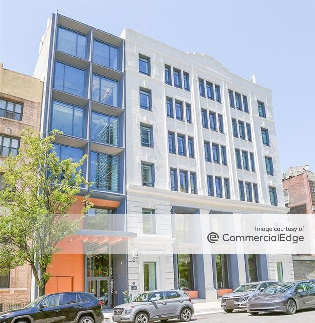 Exterior shot of InnoLabs, an office building rising six stories. The facility has a white façade.