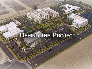 Image rendering of The Wellness Village that includes the title Behind the Project