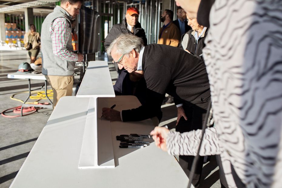 Mark Beffort signing a steel beam at Convergence Innovation District