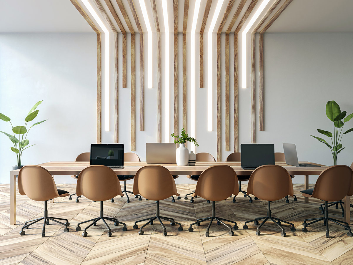 Modern office interior with wooden table and chairs, decorative plants, and vertical wooden beams with lights against a blank wall. 3D Rendering