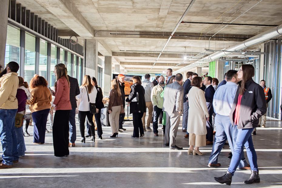 A crowd celebrating the topping off ceremony for Convergence Innovation District