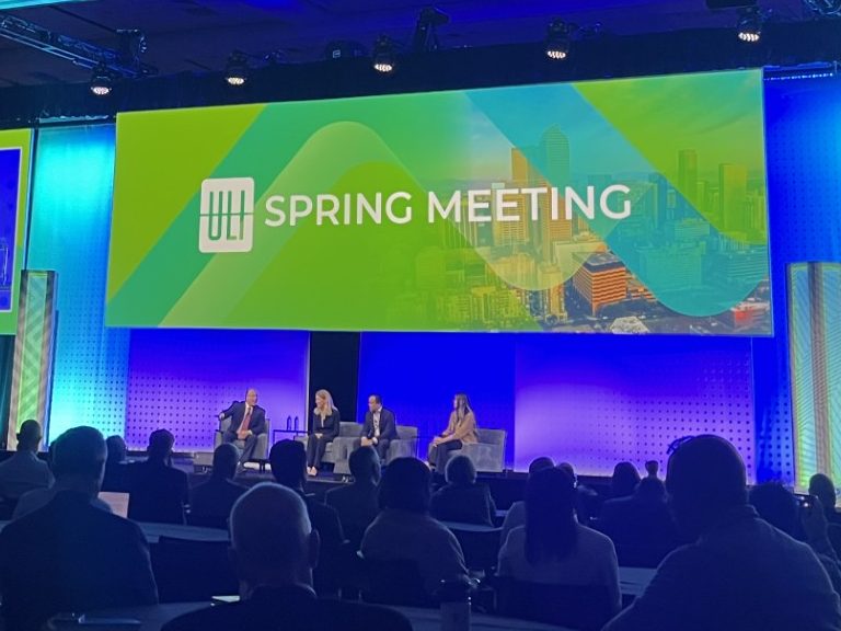 A photo of a discussion of sector predictions between CNBC's Ron Isana, Suzanne Mulvee of GID, Indy Karlekar of Clarion Partners and Heitman's Emi Adachi. =