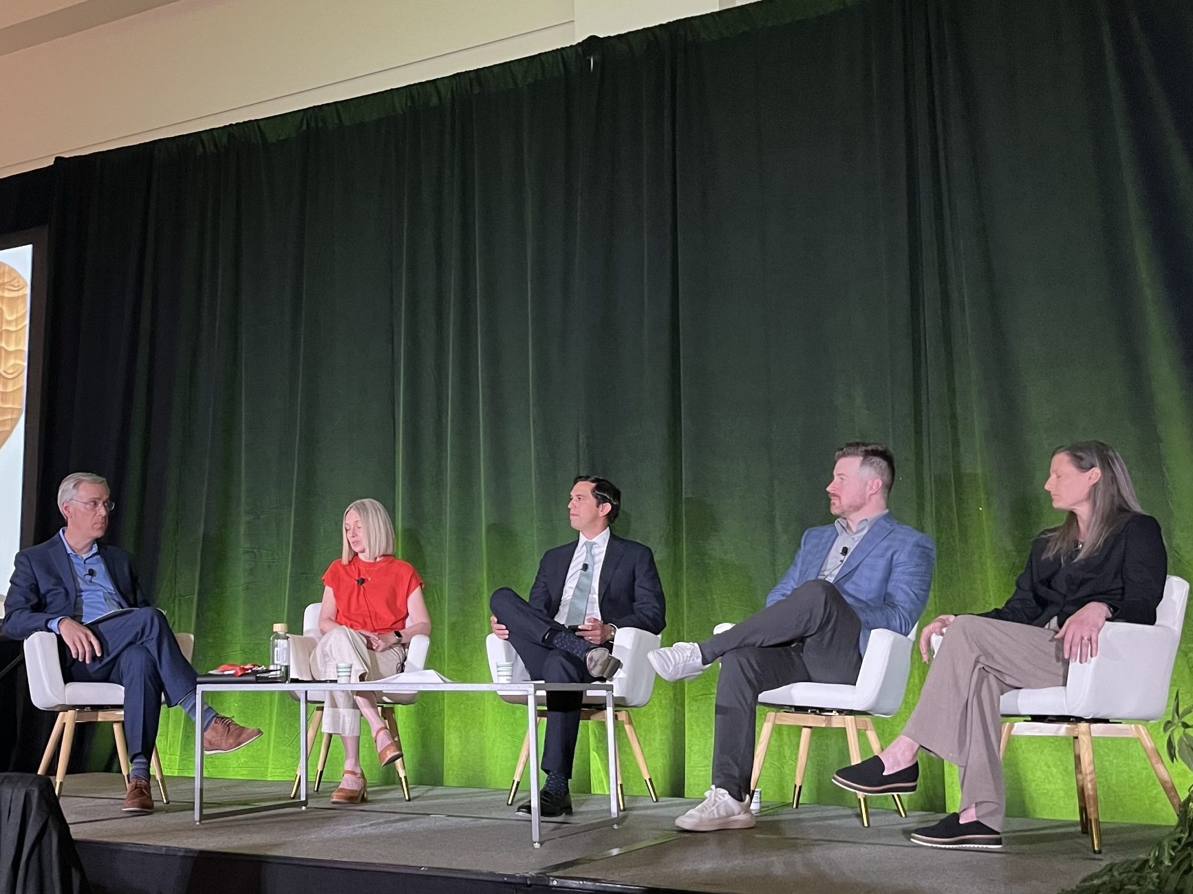 A photo of Craig Halpern of the IMA Corp. moderating the panel discussion with Jill Sherman of Edlen & Co., Redbrick LMD's Sohael Chowfla, Brian Earle and Kathy Berg of ZGF Architects.