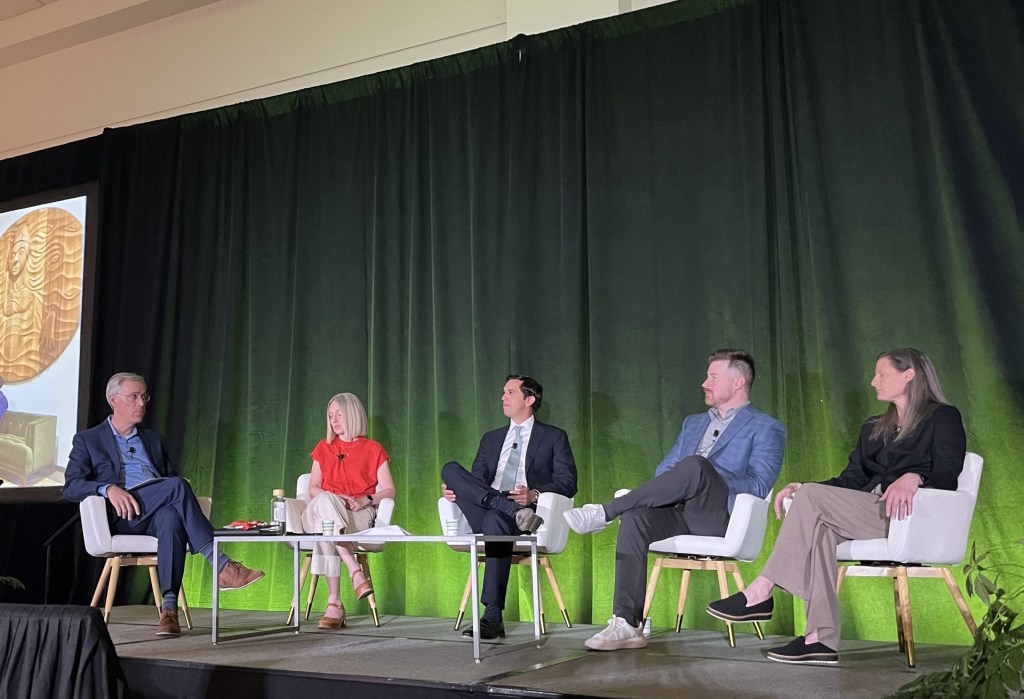 A photo of Craig Halpern of the IMA Corp. moderating the panel discussion with Jill Sherman of Edlen & Co., Redbrick LMD's Sohael Chowfla, Brian Earle and Kathy Berg of ZGF Architects.