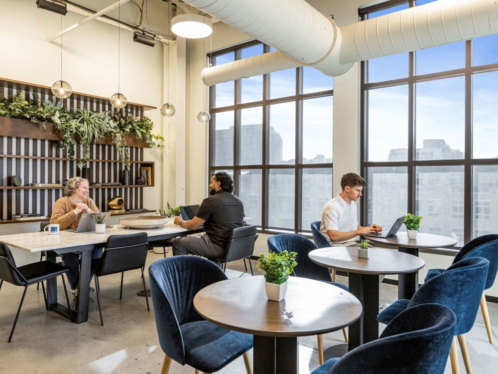Interior rendering of the new coworking location in Chicago, within the Civic Opera Building. The picture shows a lounge area.