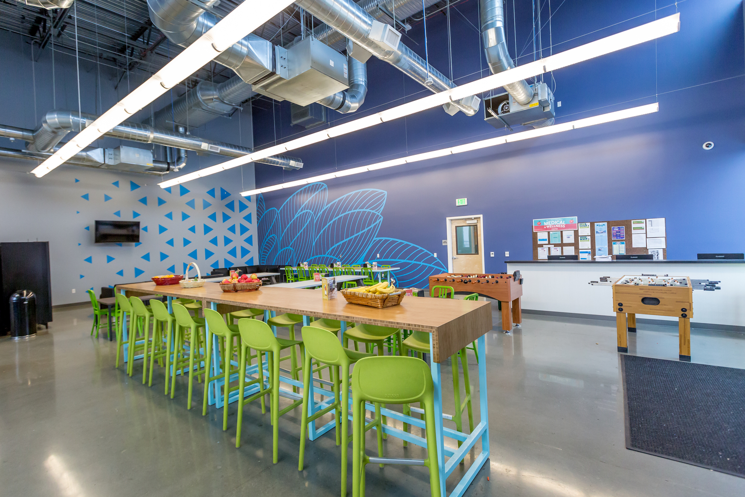 The Whole Foods Perishable Distribution Center, Vernon, Calif., contains a brightly colored break room complete with lounge seating, community tables and foosball provides a balance of productivity and fun.