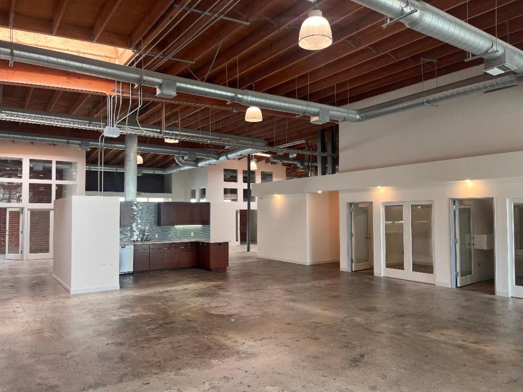Post-pandemic, industrial properties like this one owned by BLT Enterprises are being modernized with updates that ultimately add value for both owners and tenants. Open floor plans, kitchenettes and comfortable seating are attractive value-add amenities that are becoming more standard since COVID. Image courtesy of BLT Enterprises