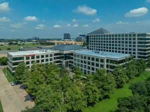 Exterior shot of the four-story office building Reserve at Westchase in Houston