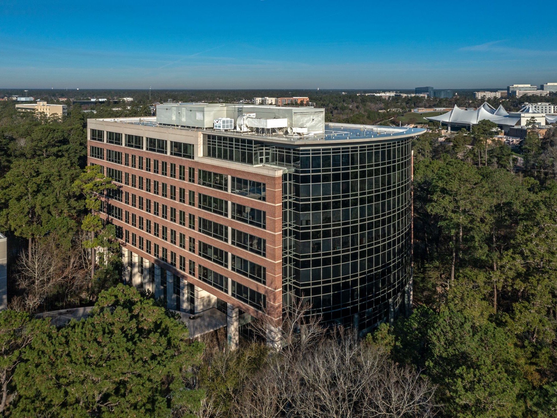 Exterior shot of 10001 Six Pines, an office building in Houston.