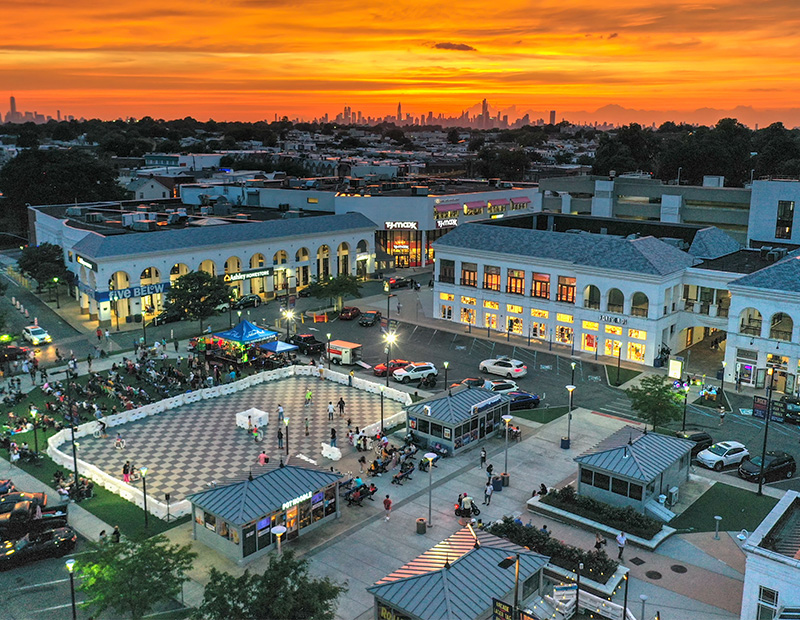 An overhead view of The Shops at Atlas Park at sunset.