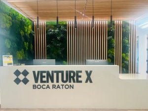 Interior shot of the front desk at Venture X's 30,000-square-foot coworking location at Palmetto Central Office Campus in Boca Raton, Fla.