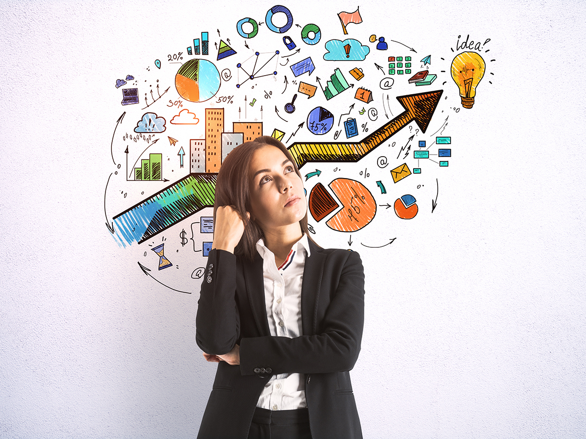 Businesswoman and drawing success marketing plan on wall. Business and management concept.