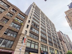 Exterior shot of 151 W 26th St., a 12-story historical office building in Manhattan.