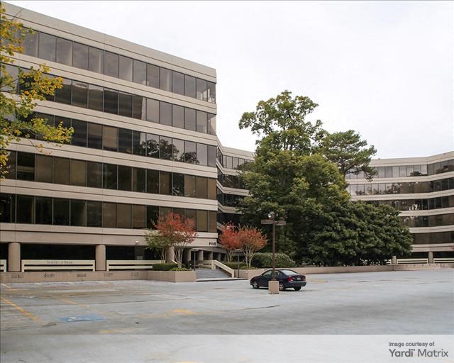 Exterior shot of a multi-story office building, part of Piedmont Center campus.