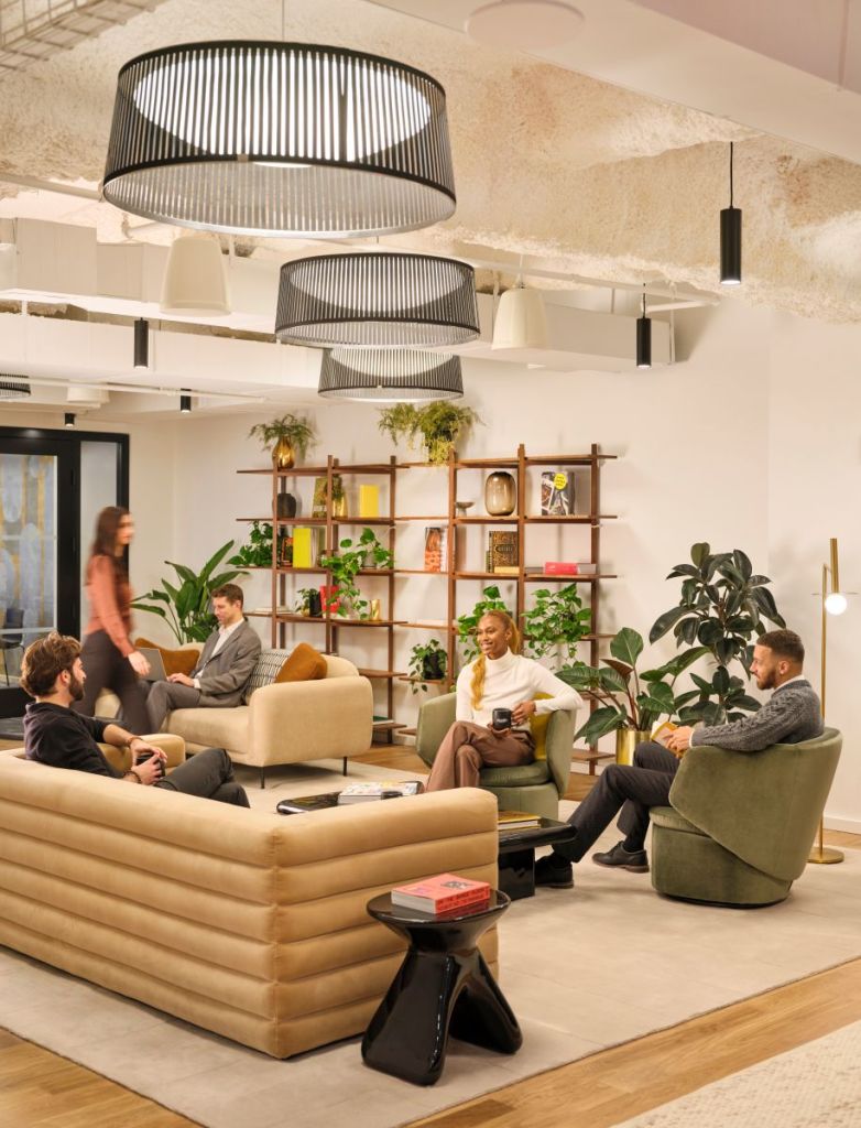 A warm, communal lounge was designed to foster casual conversations and connections in a relaxed, hospitality-inspired setting.