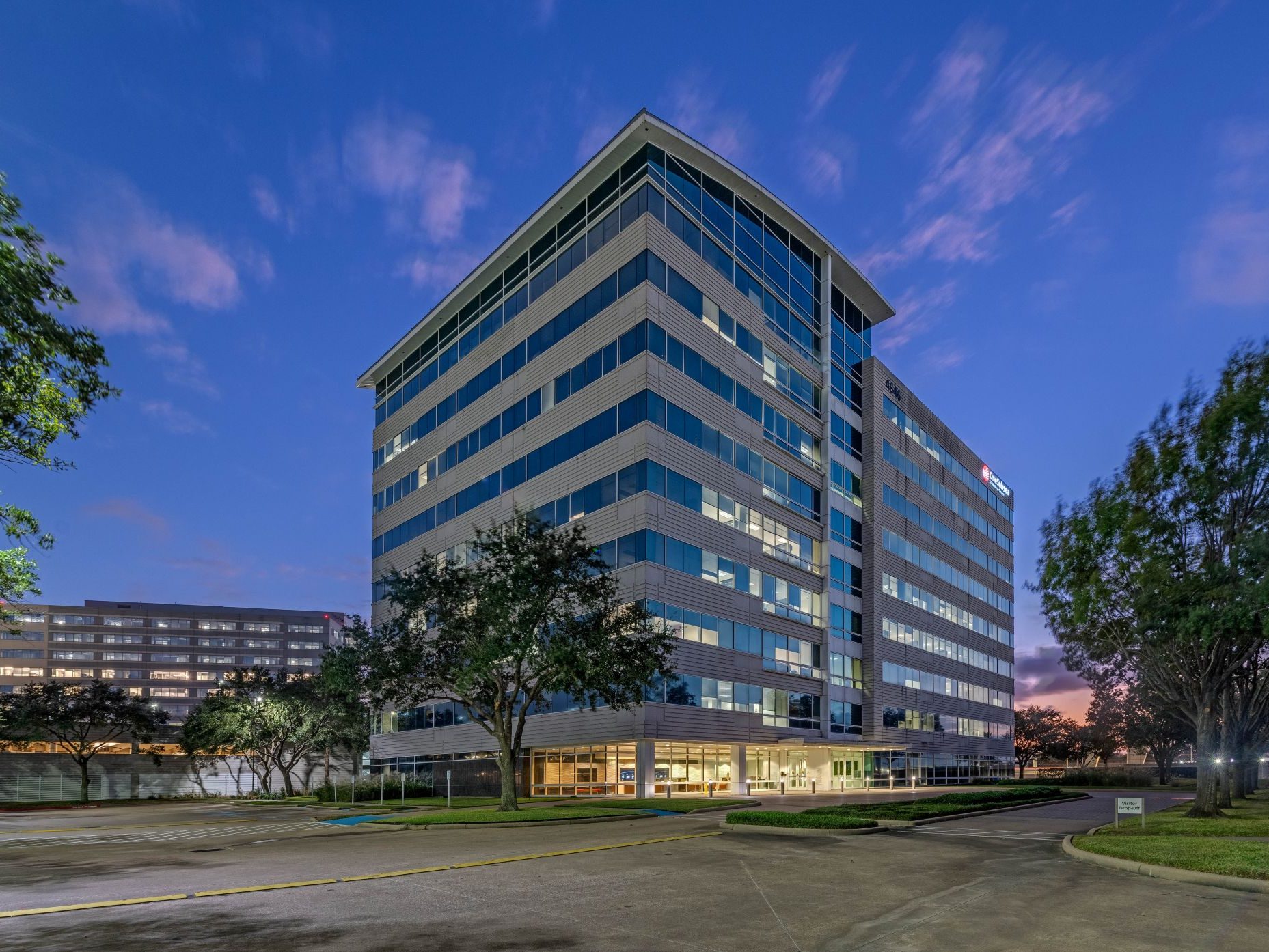Exterior shot of the 225,000-square-foot office building at 4646 W Sam Houston Parkway North in Houston, Texas.
