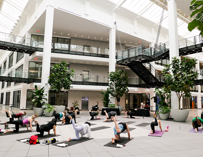 Yoga class held in the Atrium of BellWorks Chicagoland