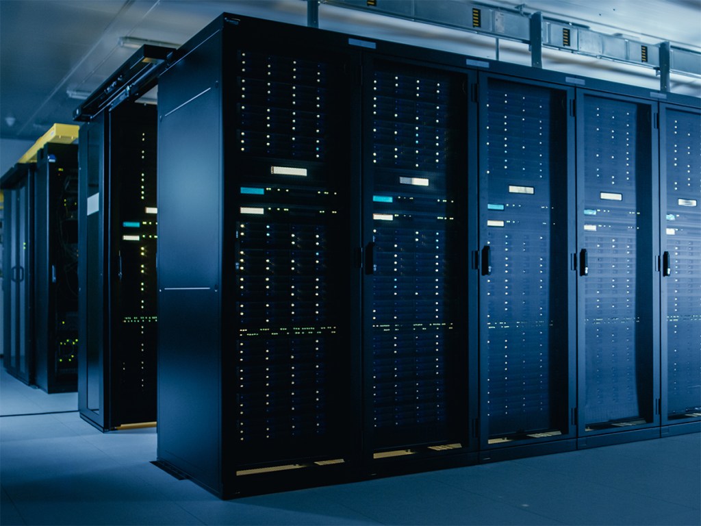 Interior of data center with data center racks and associated machinery