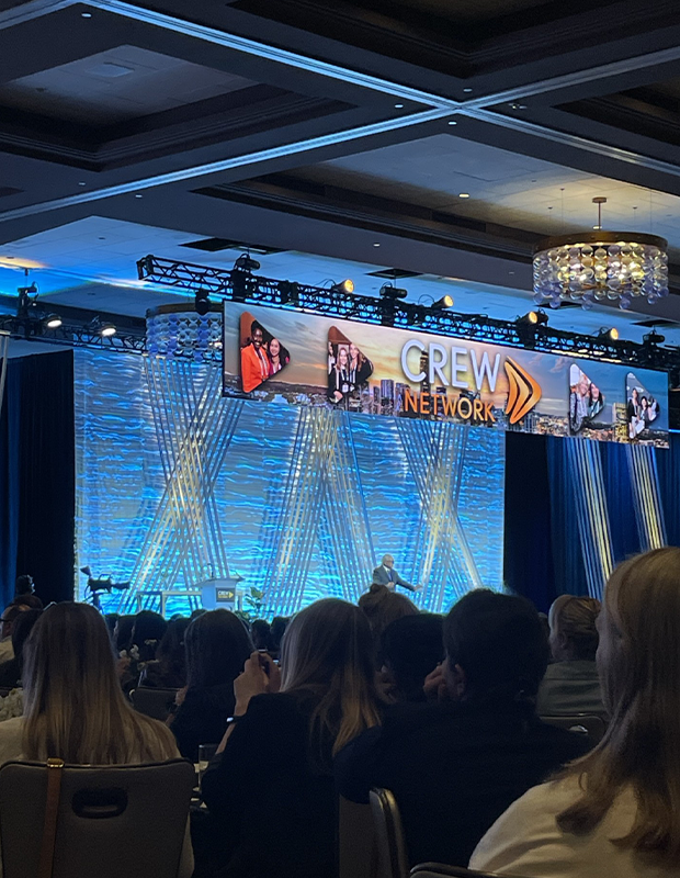 Hessam Nadji speaking at the CREW Network convention in Austin 