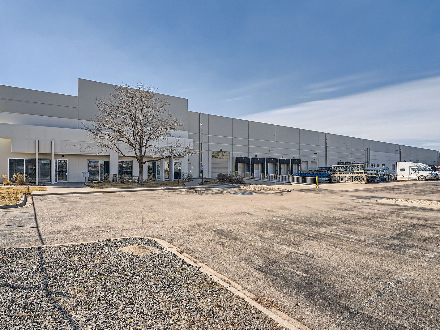 Exterior shot depicting one of the 16 warehouses acquired by Harrison Properties in Denver. 