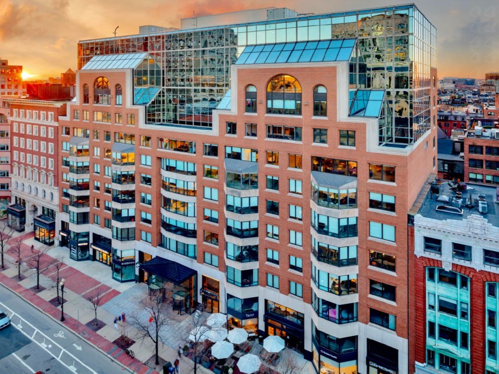 Exterior aerial rendering of the office building at 399 Boylston St. in Boston, in a row with other buildings.
