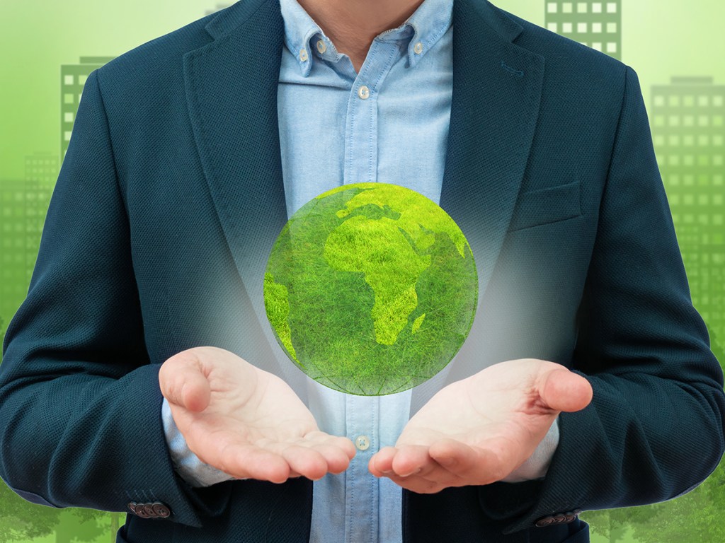 Model of the planet in male hands. Ecology protection and development and environment concept. Global network and data exchange in human hands.