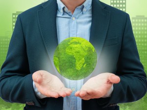 Model of the planet in male hands. Ecology protection and development and environment concept. Global network and data exchange in human hands.