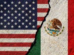 usa and mexico flags painted on concrete wall