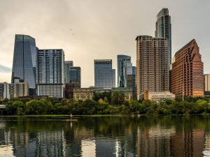 View of the downtown city skyline of Austin, Texas in summer 2025 from water level on the Lady Bird Lake.