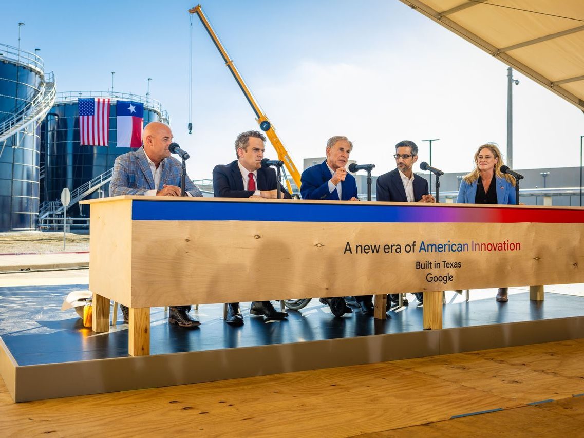 An image with Texas Governor Greg Abbott and Google CEO Sundar Pichai, as well as other members, taken at a community meeting and celebration in Midlothian, Texas.