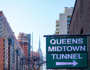 A view of the Queens Midtown Tunnel entrance with Manhattan in the background